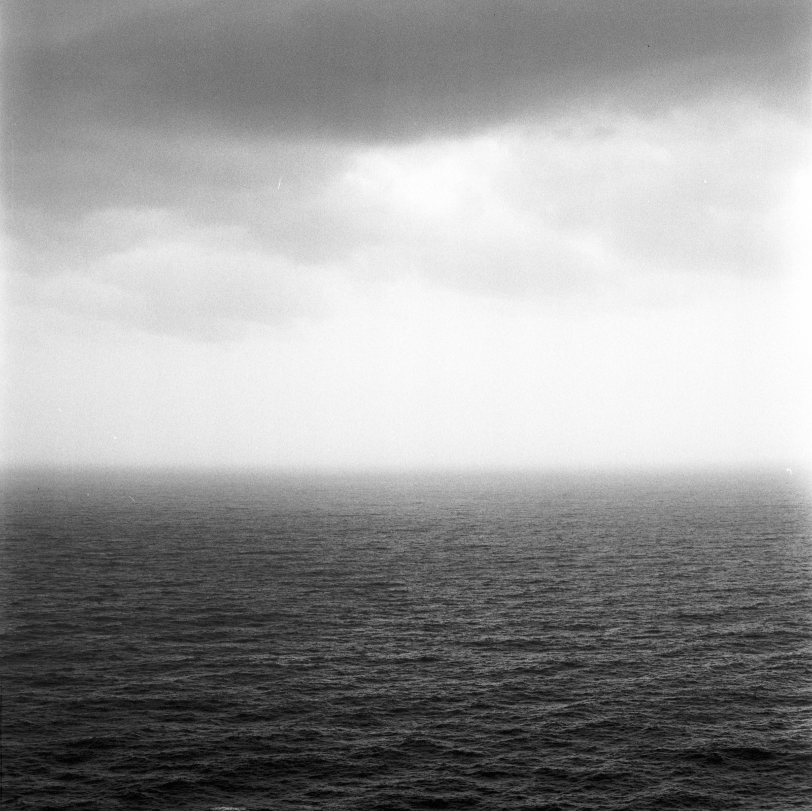 Black-and-white gelatin silver darkroom print, a seascape on film